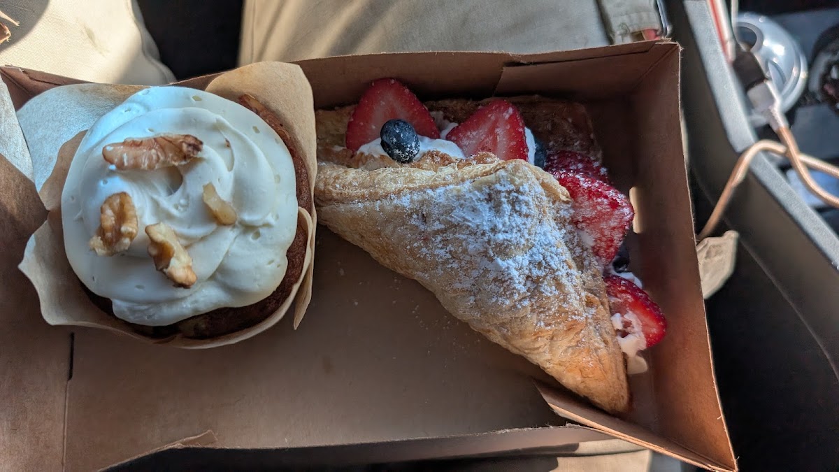 A cupcake and a berry turnover